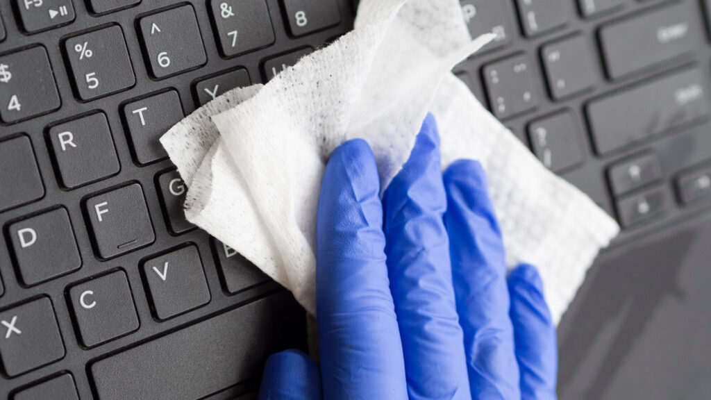 Magenta Cleaning hand sanitizing keyboard