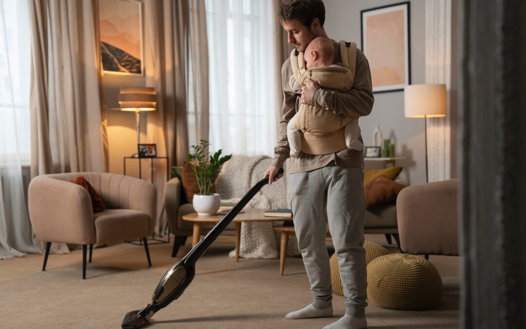 Magenta Cleaning - Dad vacuuming with baby